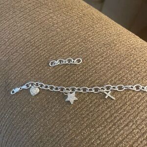 Little girl’s white gold charm bracelet